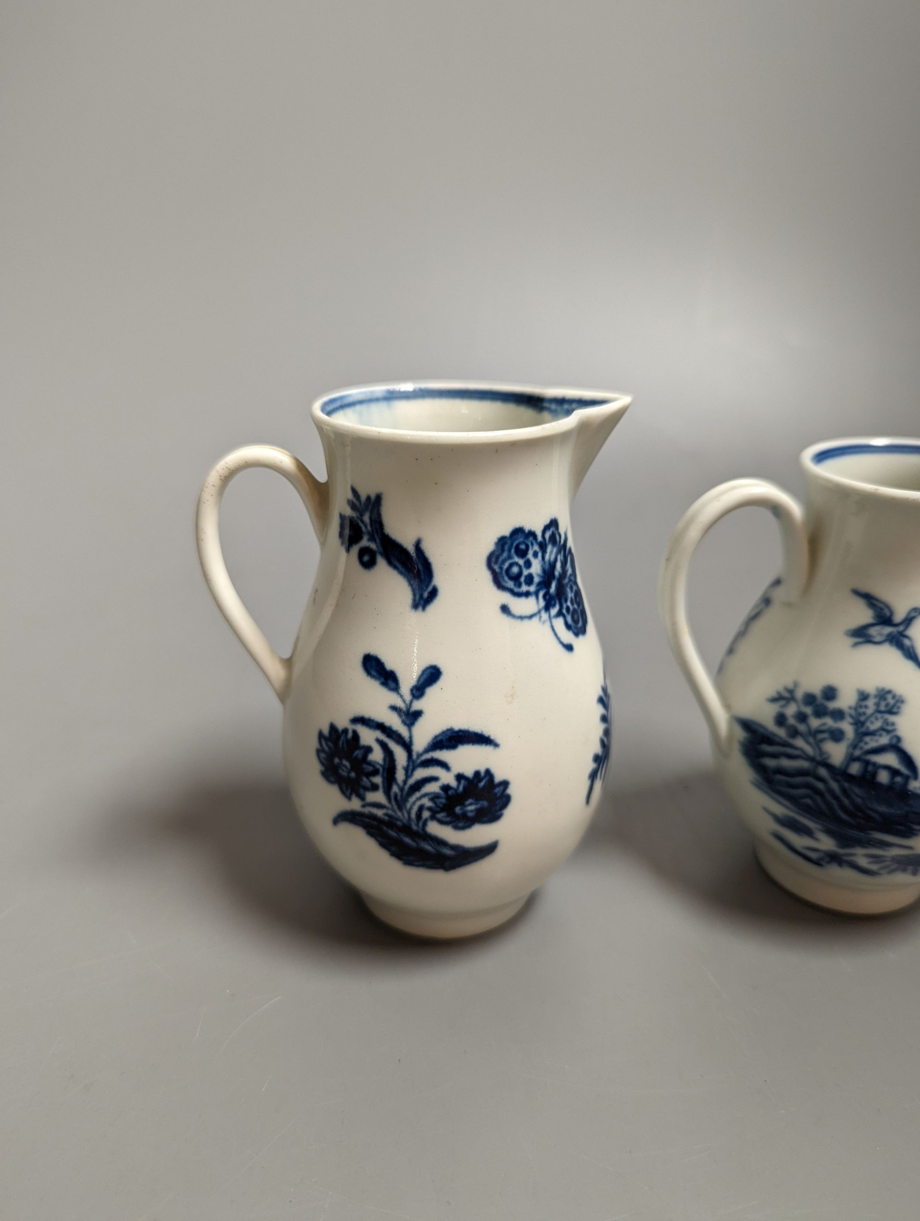 A Caughley sparrowbeak jug printed with the Three Flowers pattern and another printed with the Fence pattern, S marks